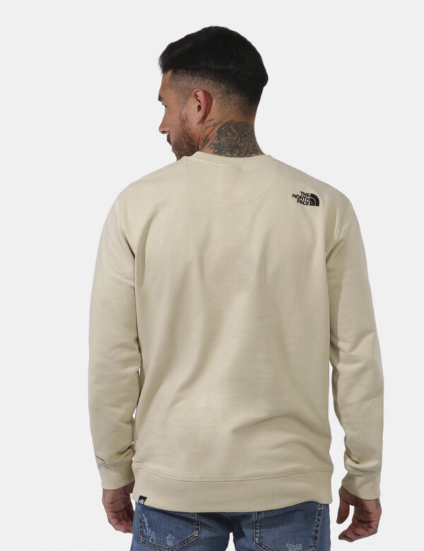 Felpa The North Face Beige - Felpa su sfondo beige con stampa centrale logo brand in nero. La vestibilità è morbida e regola