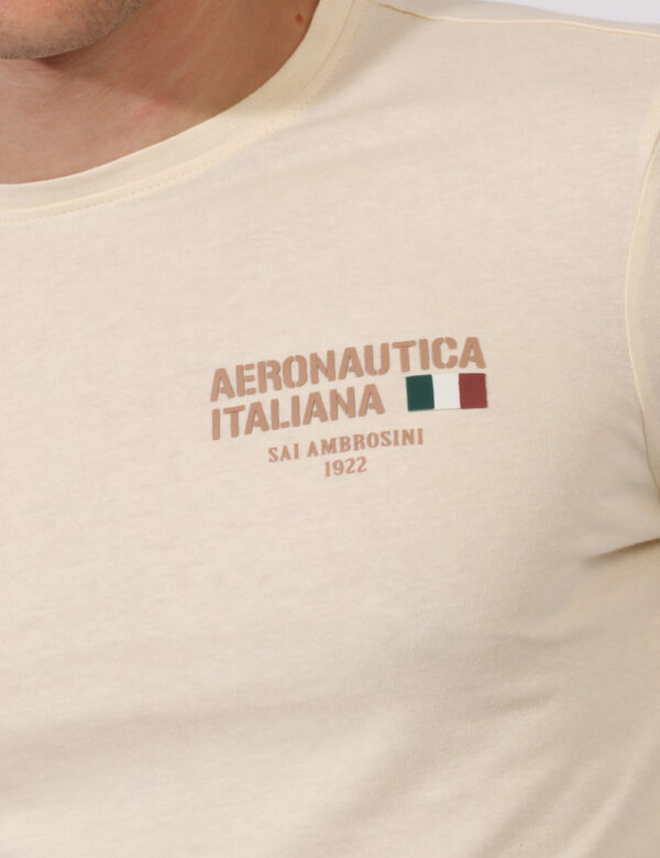 T-shirt Aeronautica Italiana Beige - T-shirt a maniche lunghe su base beige con stampa logo brand in tinta ad altezza cuore.