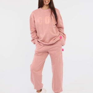 Pantaloni Icon Rosa - Pantaloni simil tuta in total rosa antico con tasche a taglio trasversale e unica bretella morbida arr